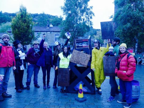 Street theatre, leafleting and a fracking rig in Hebden Bridge, 14 October 2018. Photo: DrillOrDrop